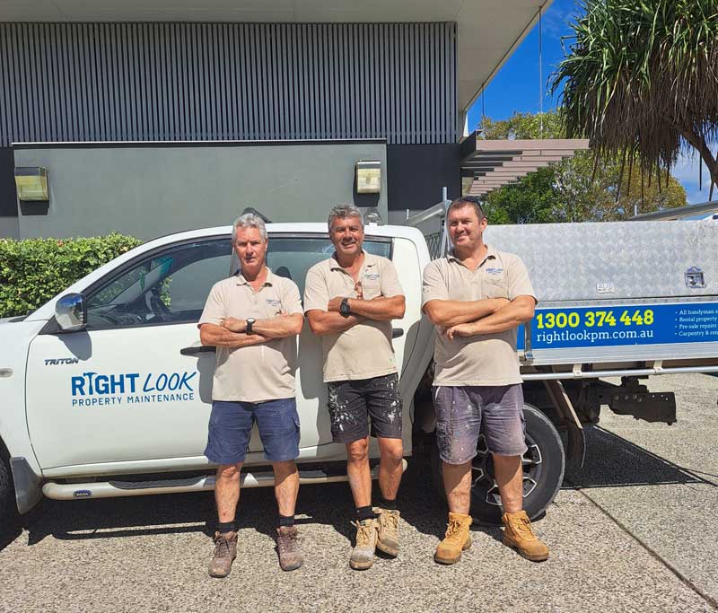 Three individuals with standing in front of a white truck with the logo for Right Look Property Maintenance.